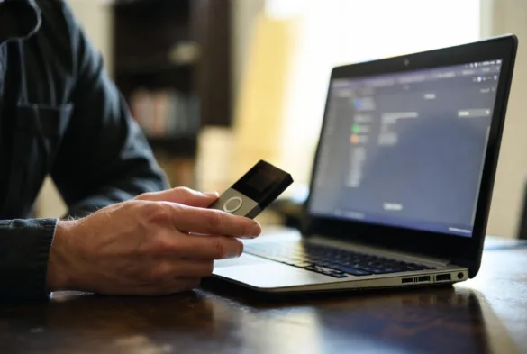 hardware crypto wallet connected to laptop for secure storage
