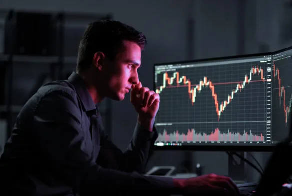 Trader monitoring Bitcoin chart to profit from falling prices